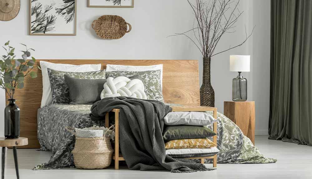 A bedroom with a bed and a bedside table.