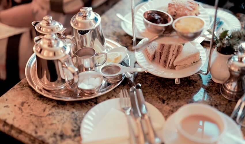 A table with tea and coffee on it.