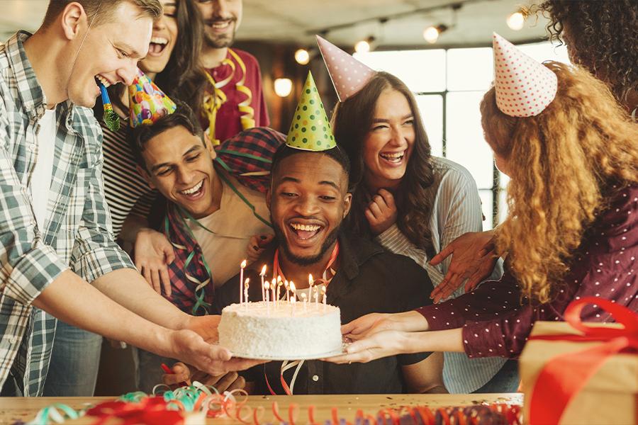A group of friends celebrating a birthday.