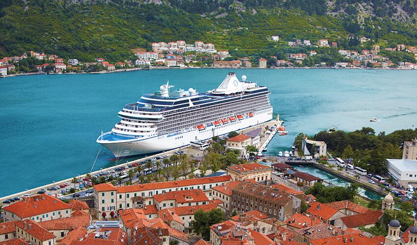 A cruise ship docked at a dock.