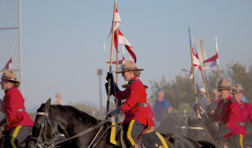 A group of men on horses.