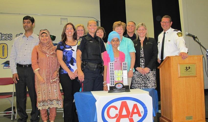 A group of people standing in front of a podium.