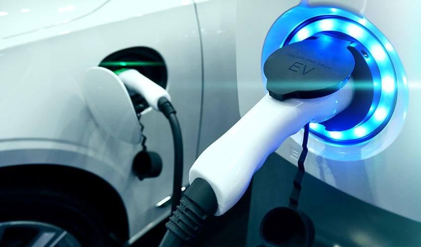 A car is plugged into an electric charger.