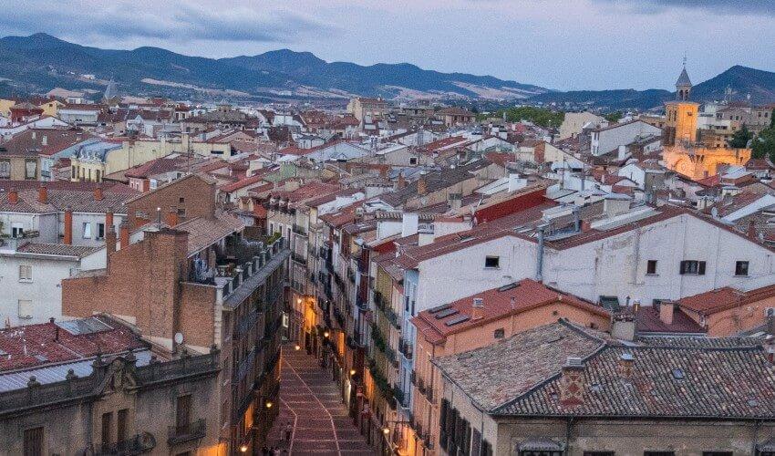 An aerial view of a city at dusk.