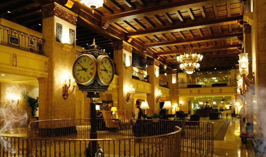 A large lobby with a large clock.
