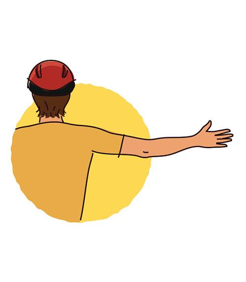 A man wearing a helmet with his arms outstretched.