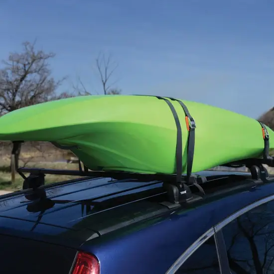 A green kayak on top of a car.