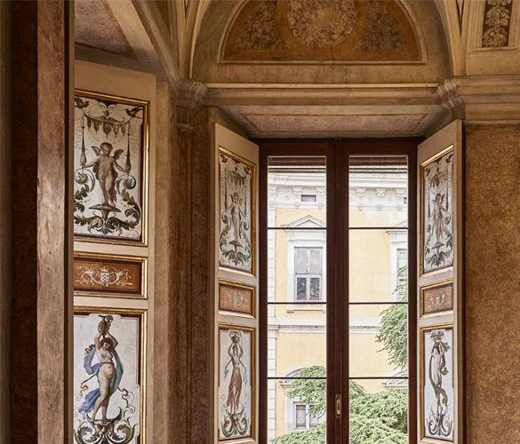 An ornately decorated room with a large window.