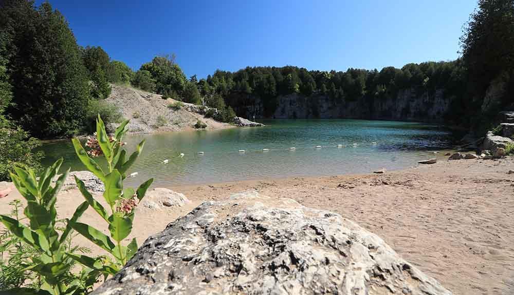 A lake surrounded by rocks and trees.