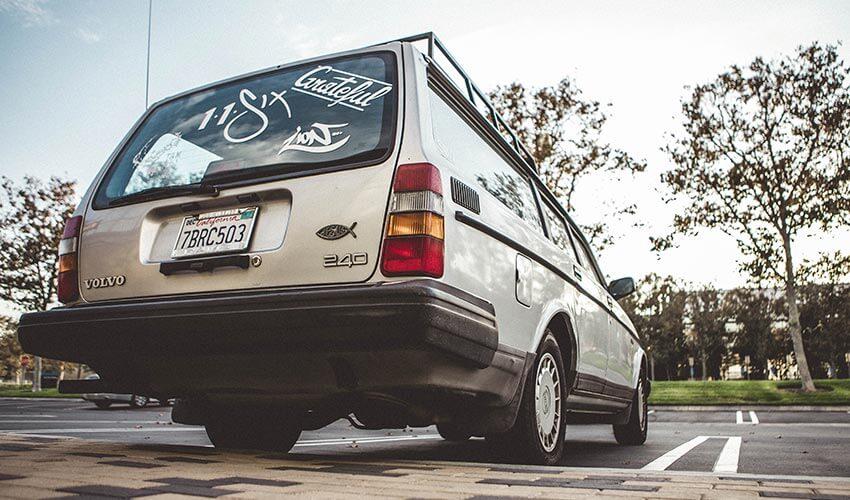 A white van parked in a parking lot.