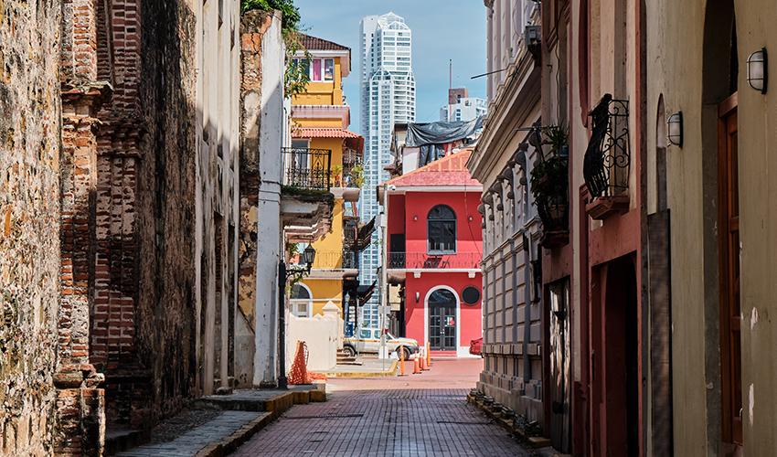 A narrow alley with buildings in the background.