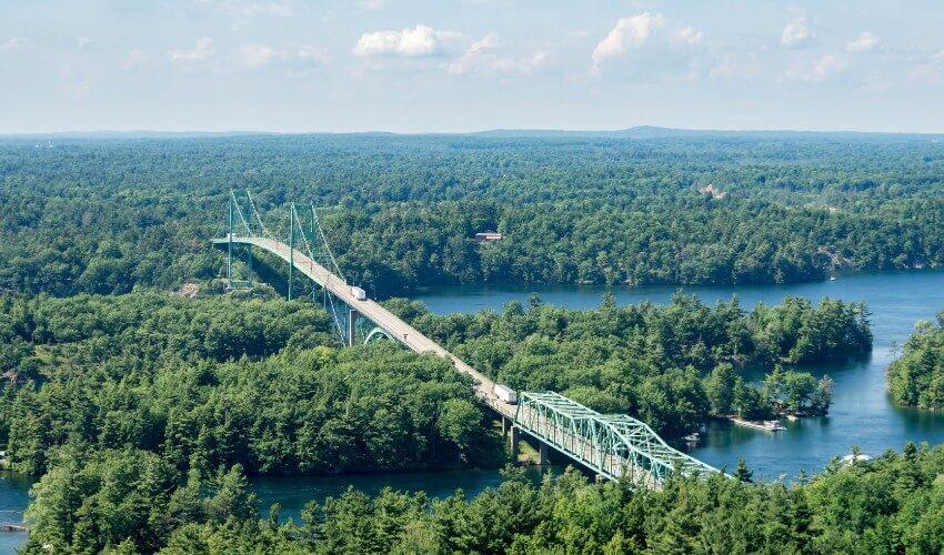 An aerial view of a bridge over a body of water.
