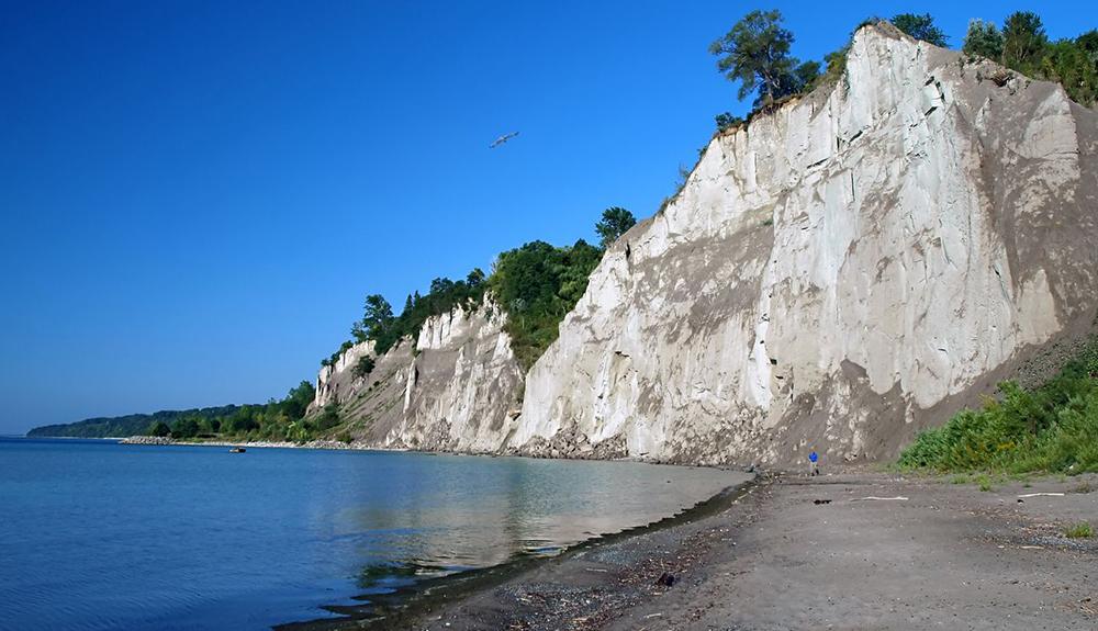 Cliffs on the shore of a body of water.