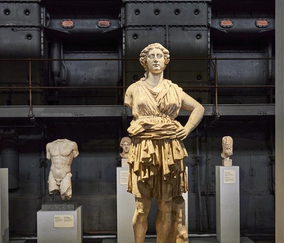 A statue of a woman in a museum.