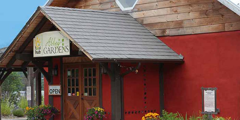 A red building with a wooden door.