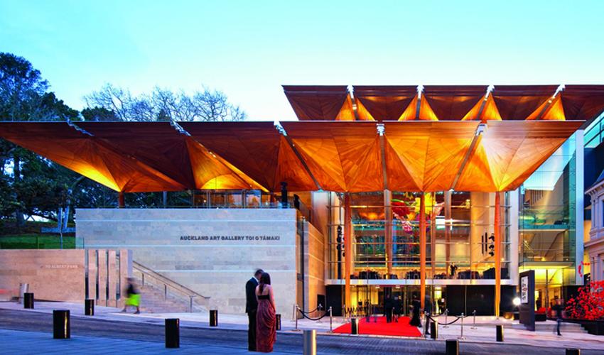 A large building with a red carpet.