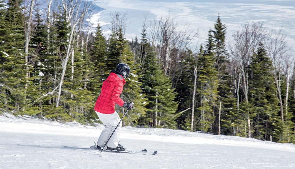 A person on skis on a snowy slope.