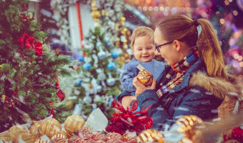 A woman and a child at a christmas market.