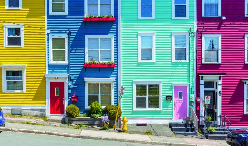 A row of colorful houses on a street in nova scotia.