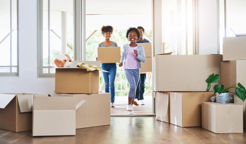 A group of people moving into a new home.