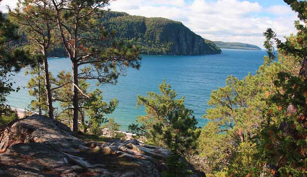 A view of the ocean from a rocky cliff.